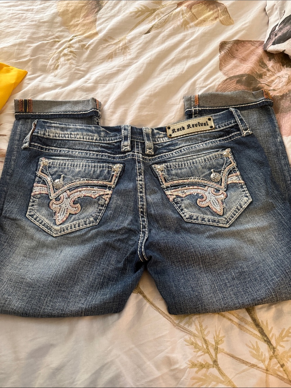 Rock Revival Cropped Cuffed Capri Jeans with Embroidered Pockets.